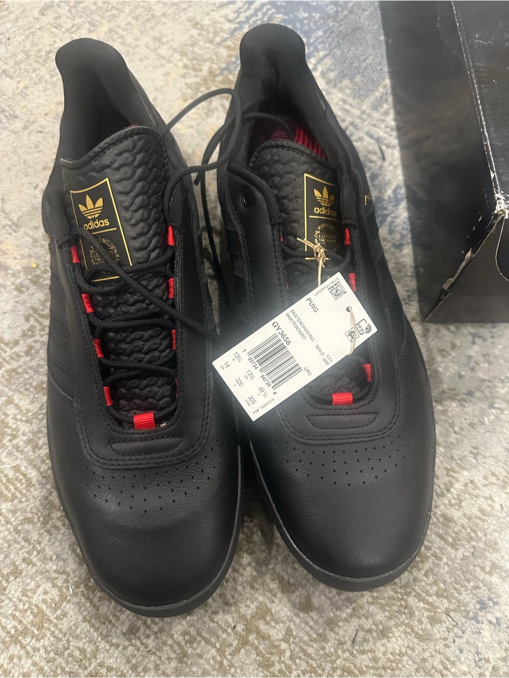 adidas Black Sneakers with Red Accents and Gold Logo